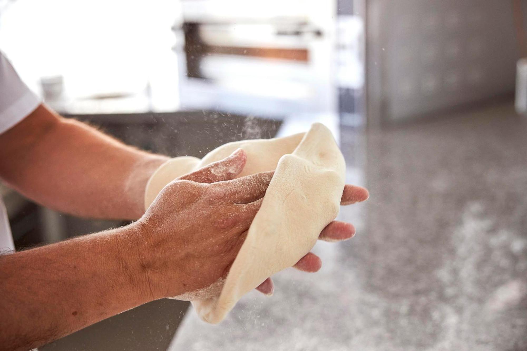 Monchique Resort & Spa Экстерьер фото A baker kneading bread dough